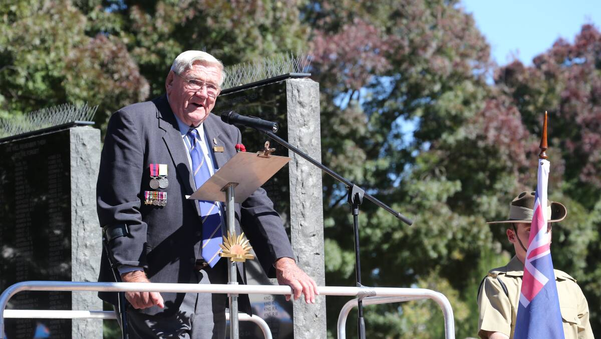 Jim McGann addressing the crowd on Anzac Day 2014. PHOTO: The Area News archives.