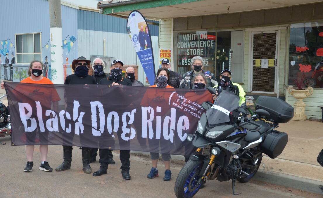 MAGNIFICENT SEVEN: Black Dog Riders stop at Whitton ahead of the start of their seven rides around the Riverina in the next seven days. PHOTO: Declan Rurenga