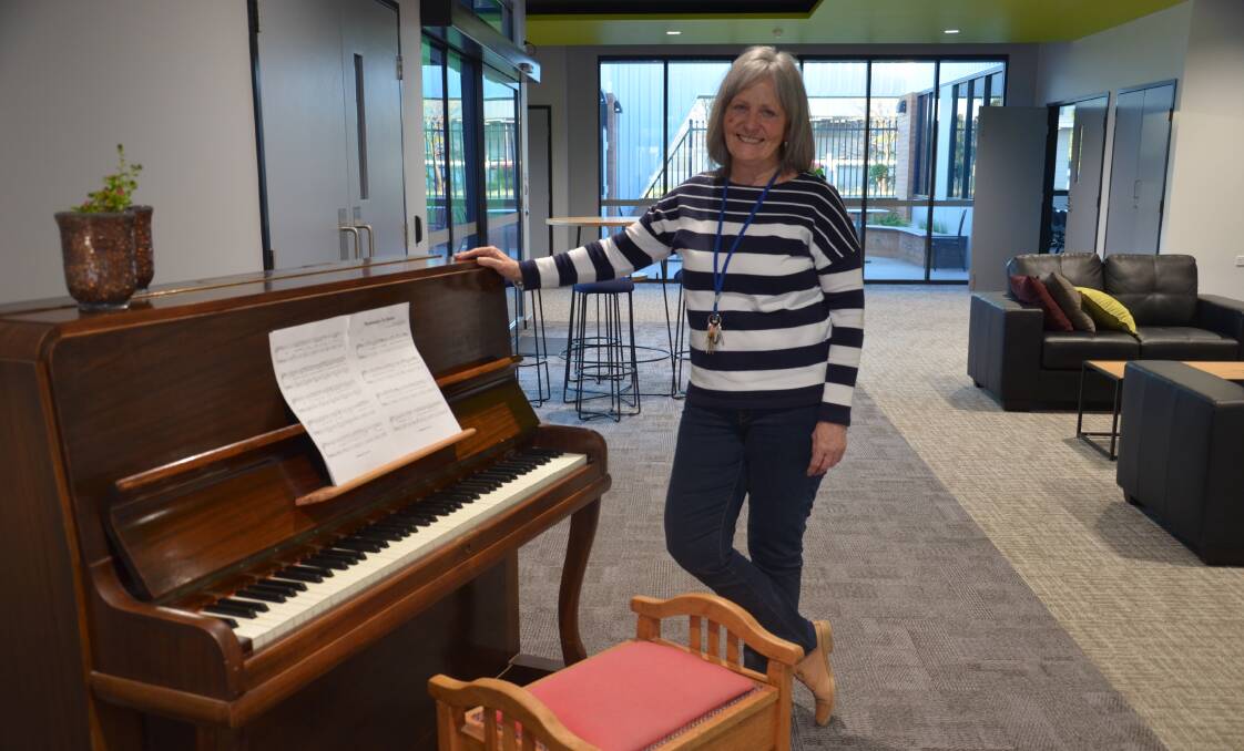 WELCOME: Griffith Community Centre co-ordinator Peta Dummett, in the new Olympic Street centre, says residents are welcome to visit and perhaps play a tune. PHOTO: Declan Rurenga