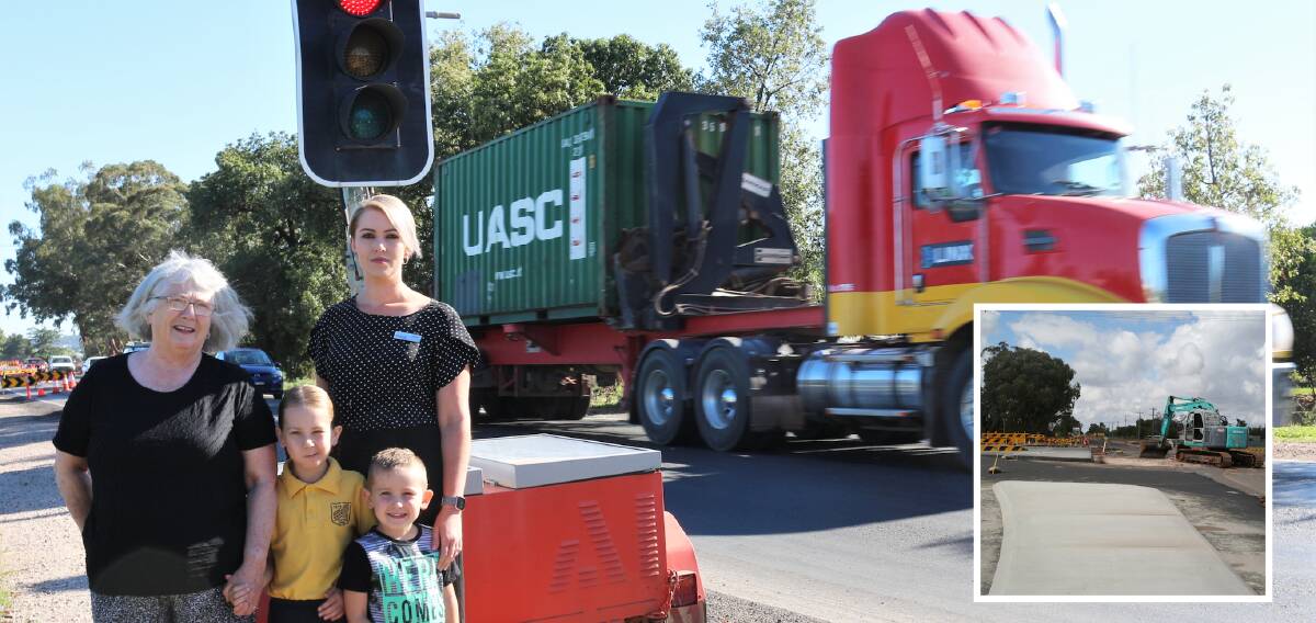 WAIT: Mum Kaitlyn Favero with kids Alani and Charley Favero and Deirdre Favero stand by the traffic control on Kidman Way. Picture: Reuben Wylie. INSET: The roundabout