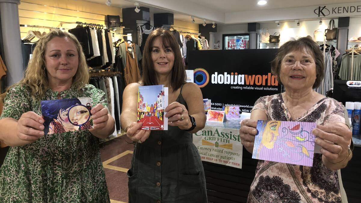 MEANINGFUL MESSAGE: Artist Lisa Taliano, Kendells store manager Tracey Pisan and Can Assist's Olga Forner with new cards available at Kendells. PHOTO: Declan Rurenga