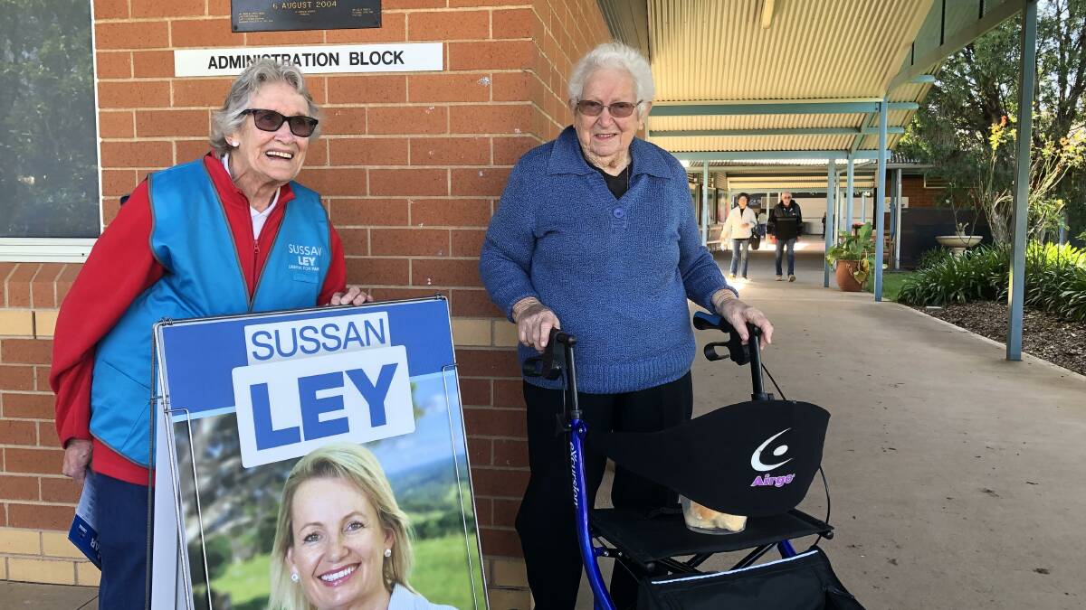 Barbara Jefferies volunteering for Sussan Ley at Yenda Public School and catching up with her friend Gladys Cannard on Saturday. PHOTO: Declan Rurenga