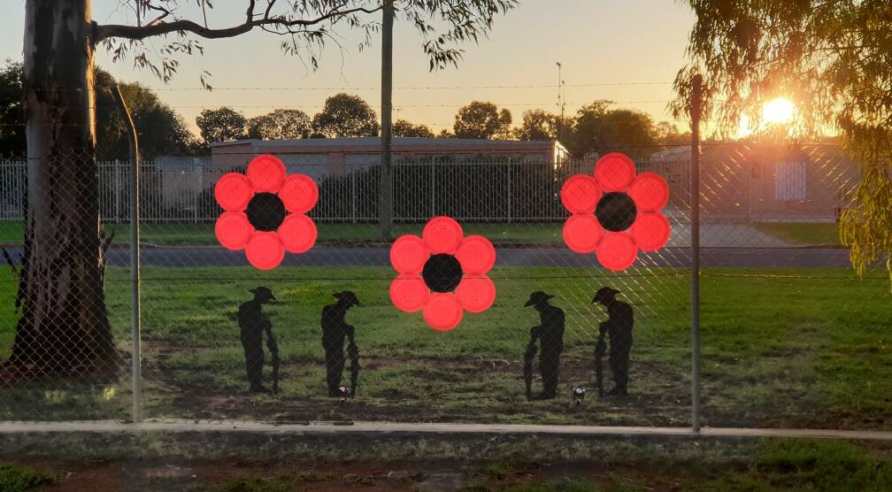 GLOWING: The afternoon sun lights up the Anzac Day outside ICI Industries display on Harris Road. PHOTO: Margarita Day