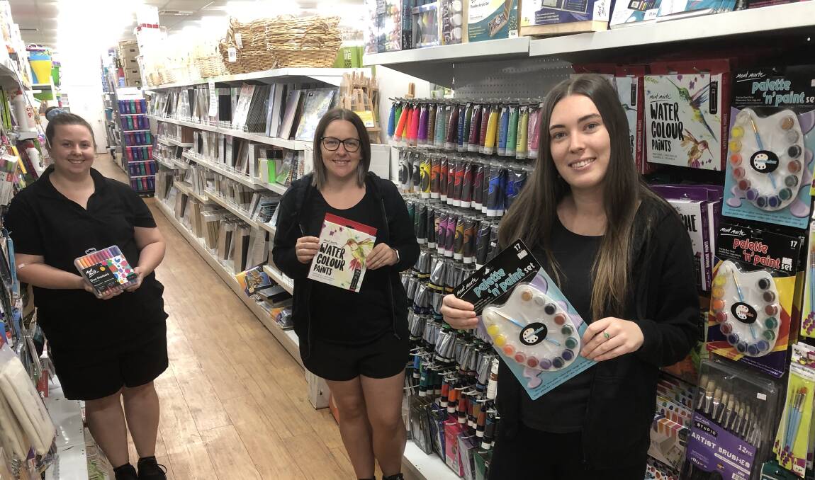 CREATIVITY: Bargain Buys' Kirstie Johnston, Alicia Bourke and Cloye Ford in the store's art and craft section which has proven popular as parents look to keep children entertained. PHOTO: Declan Rurenga