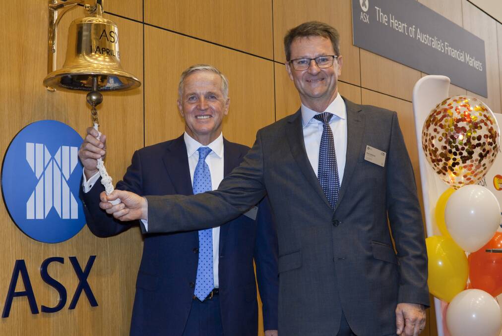 SunRice chairman Laurie Arthur and CEO Rob Gordon ring the opening bell for the ASX on Monday. PHOTO: Contributed
