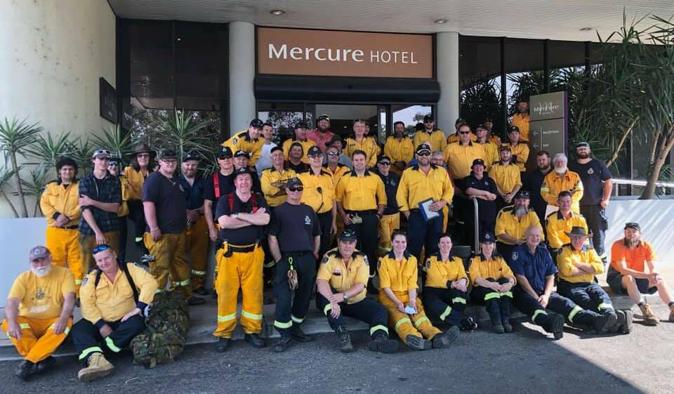 HELPING HANDS: Strike team Southern 2040 and 2041 stop for a photo during the deployment to Sydney. PHOTO: Contributed
