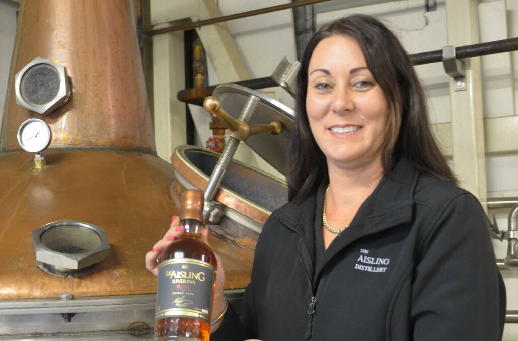 BEST IN THE LAND: The Aisling Distillery director Michelle Burns with a bottle of their award winning Riverina Rum which won Best Rum Trophy at the Tasting Australian Spirit Awards. PHOTO: Declan Rurenga