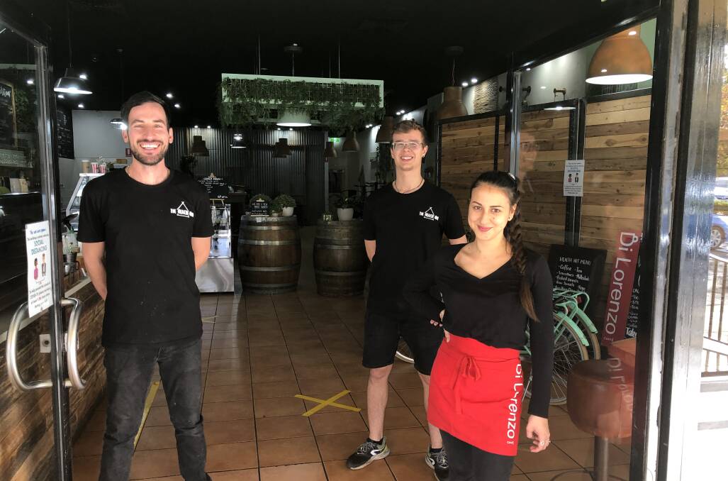SMALL STEPS: Health Hut owner James Cimador with staff members Matteo Rasetto and Sara Notorio. Mr Cimador said changes to trading restrictions are 'small steps'. PHOTO: Declan Rurenga
