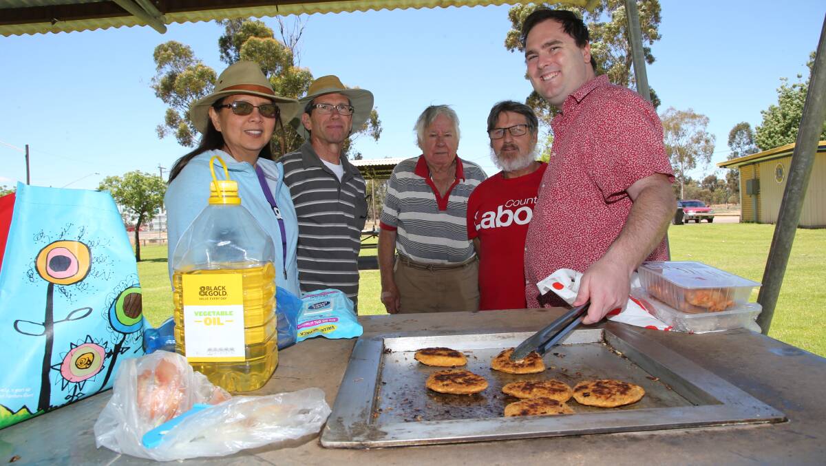 BREAKING BREAD: Joy and Geoff Schubert, Laurie Finley, David Bell and federal candidate Kieran Drabsch at Darlington Point last year. Picture: Anthony Stipo