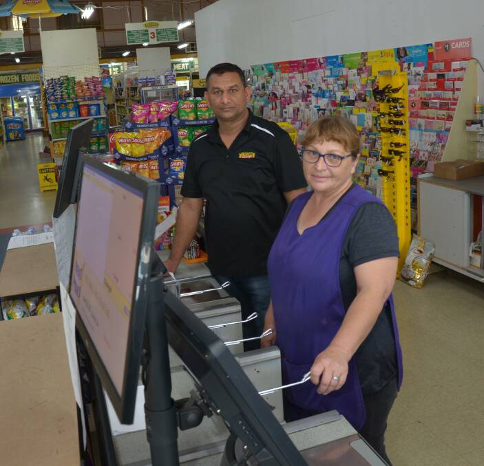 Yenda Friendly Grocer store manager Yogesh Bhatt and staff member Carol Johnson.