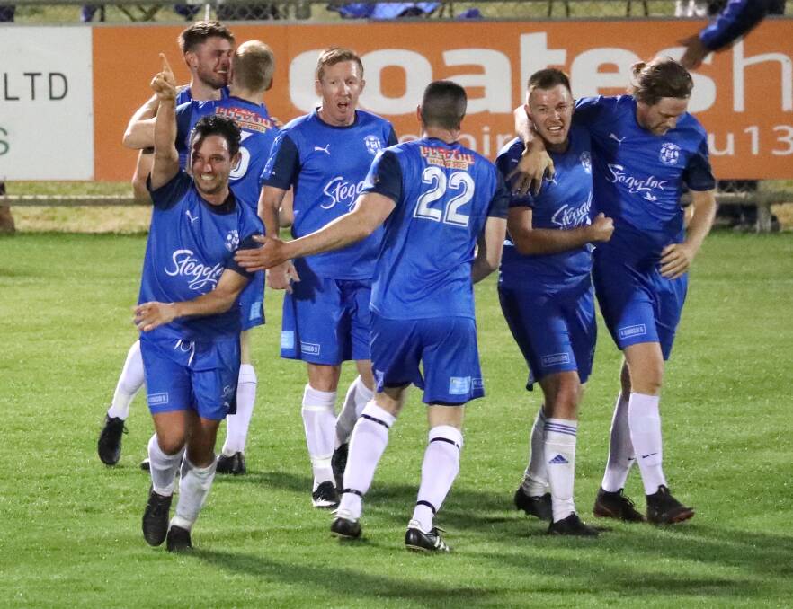 Joey Schirripa (left) celebrates after his second goal during Hanwood FC's Pascoe Cup grand final win in 2019.