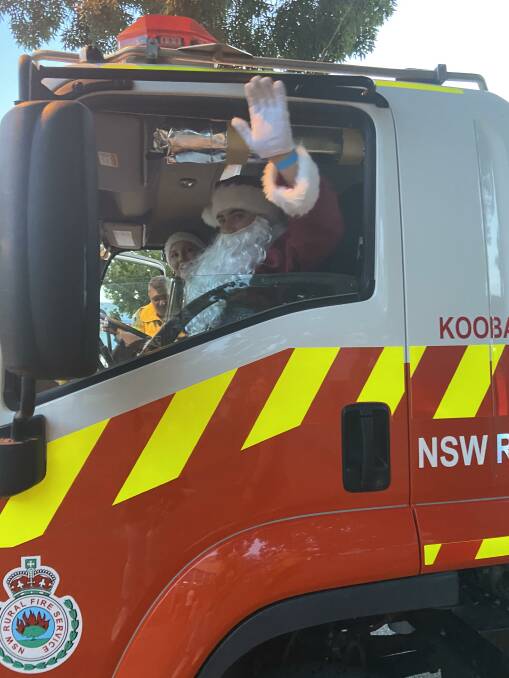 MADE THE LIST: Santa Claus caught a lift with some NSW RFS volunteers in 2020. PHOTO: Contributed