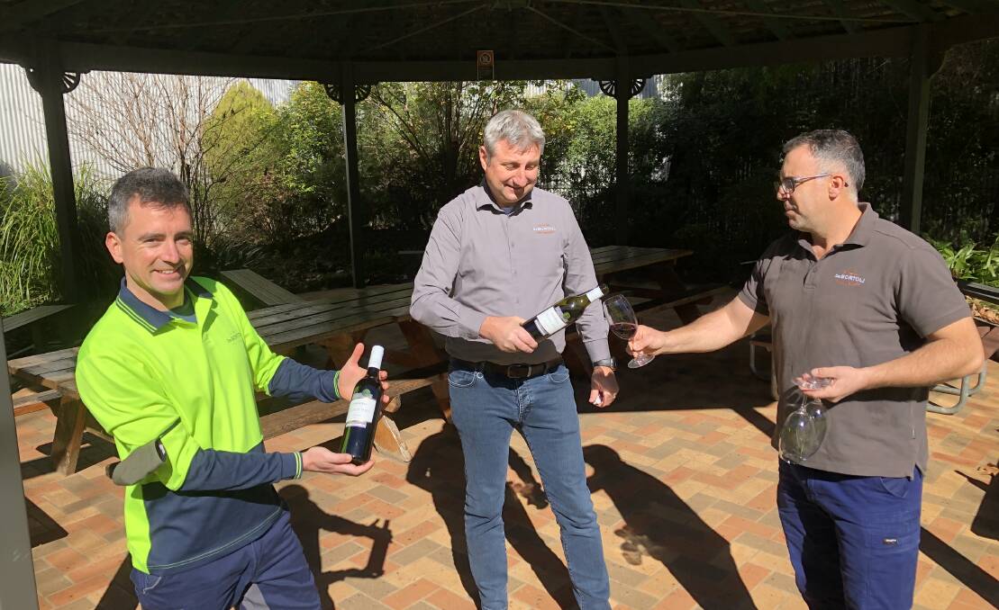 GOOD DROP: De Bortoli Wines winemakers Matteo Lapi (left) and Roberto Delgado along with executive director Victor De Bortoli prepare a taste test. PHOTO: Declan Rurenga