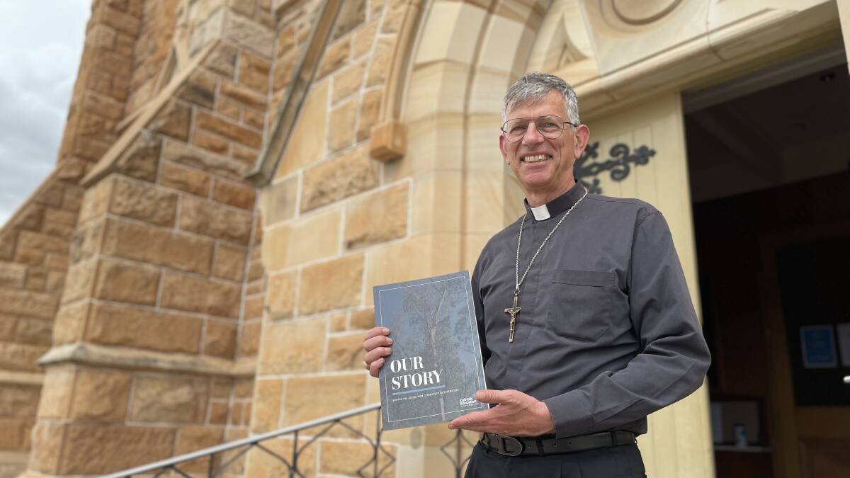 GENERATION TO GENERATION: Bishop Mark Edwards launched the Wagga diocese's new commemorative book last week. PHOTO: Emily Wind