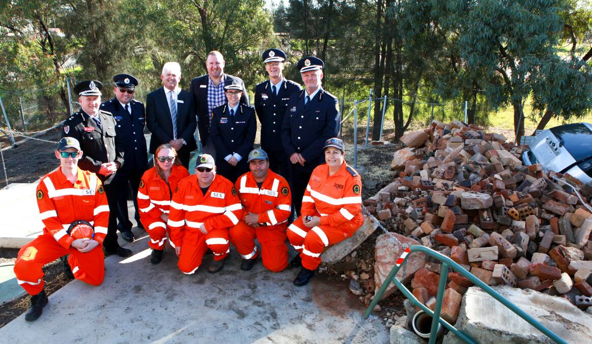 TRAINING CENTRE: Fire and Rescue NSW's Bob Sayer (back, left), Micheal Borg from NSW RFS, Griffith City Council's general manager Brett Stonestreet, deputy mayor Doug Curran, Nichole Priest, Kyle Stuart, Richard Mortlock from NSW SES with volunteers Edward Murwood (front, left), Naomi Cox, Robert Oliver, Craig Hodge and Sonya Armanini. PHOTO: Contributed