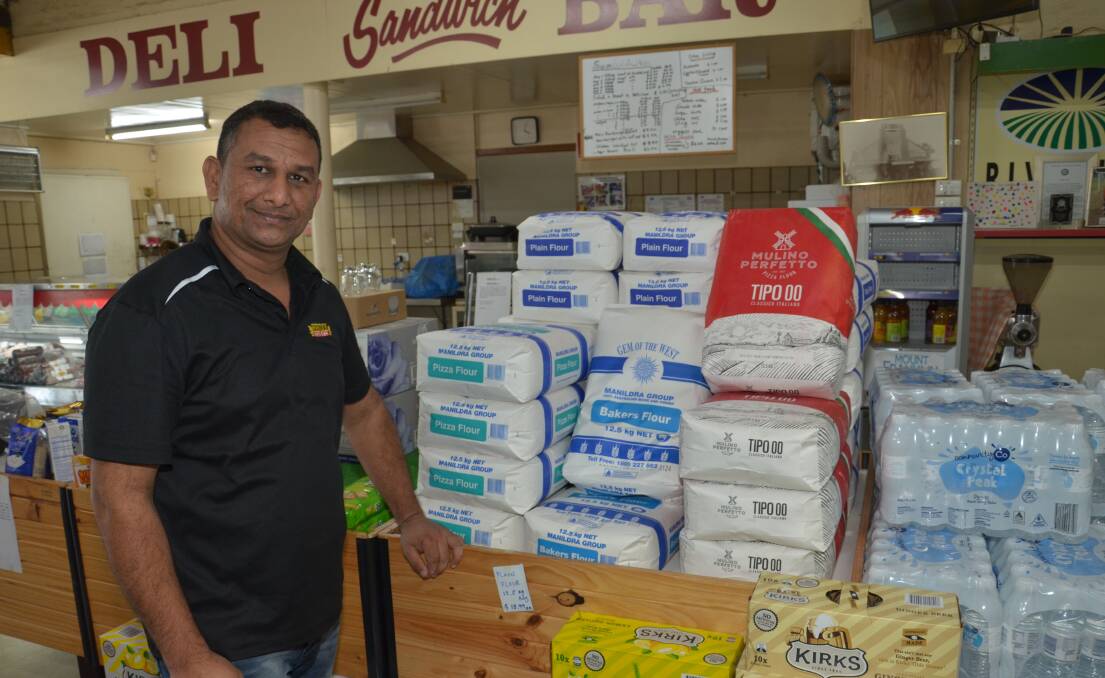 PREPACKED: Yenda Friendly Grocer's Yogesh Bhatt said the store's elderly customers could ask for home delivery if they wanted to avoid heading to Griffith.
