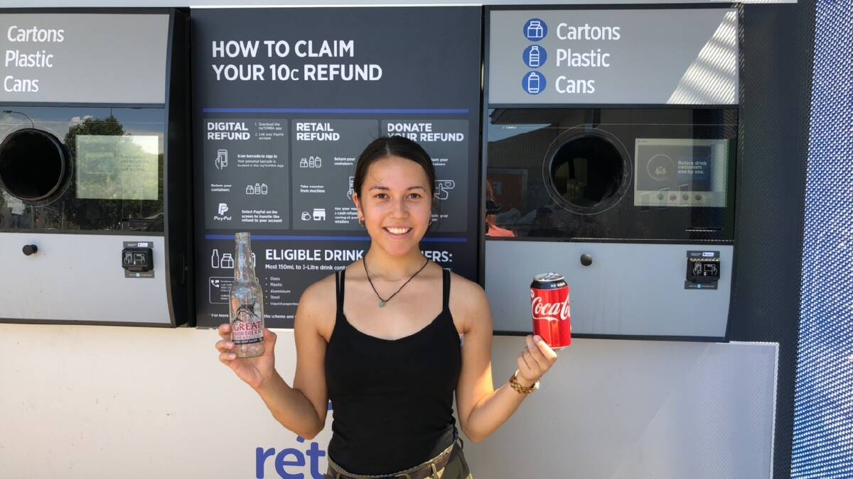 CAN DO: Griffith woman Daniella Collison was on hand to demonstrate how to use the reverse vending machine when it first arrived in town. Photo: JACINTA DICKINS