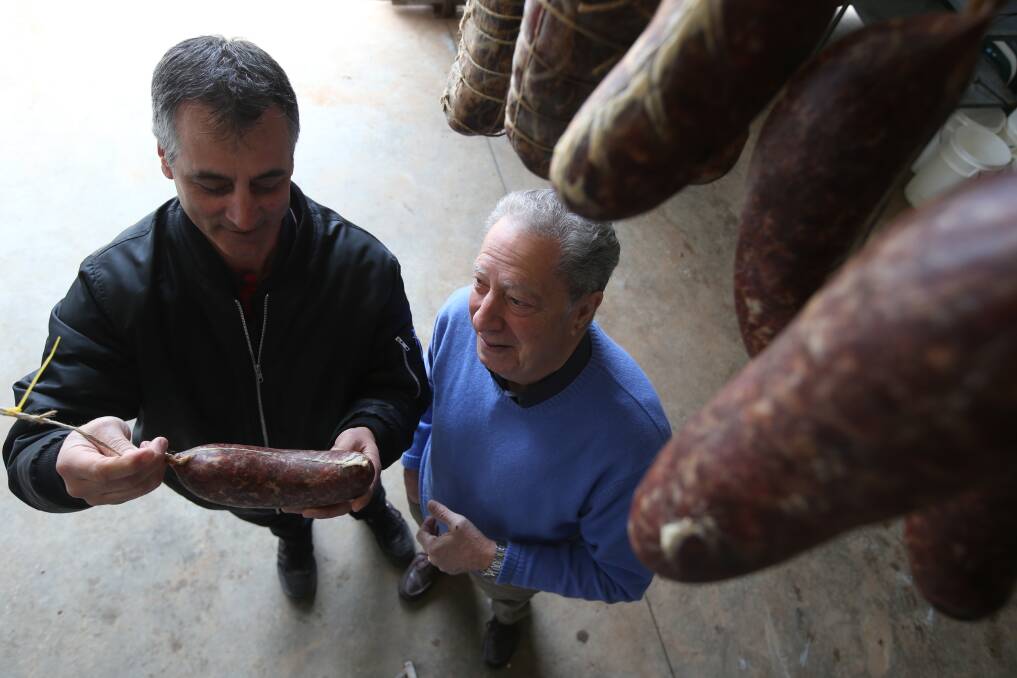 WEIGHING UP: Salami festival organisers Nigel Ippoliti and Roy Catanzariti as they were preparing for last year's event. Photo: ANTHONY STIPO