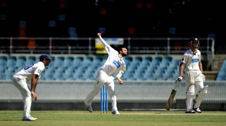 NSW bowler Nathan Lyon in action on Wednesay at Manuka Oval. Photo: Melissa Adams
