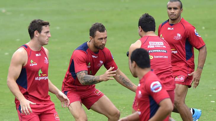 Red tide: Quade Cooper trains with the rampant Queensland Reds. Photo: Bradley Kanaris