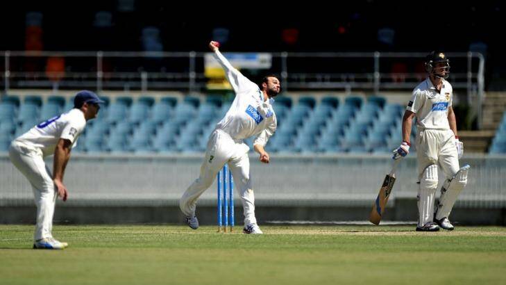 NSW bowler Nathan Lyon in action on Wednesay at Manuka Oval. Photo: Melissa Adams