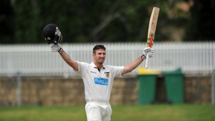 West Australian Shaun Marsh celebrates his century against NSW at Manuka Oval. Photo: Graham Tidy