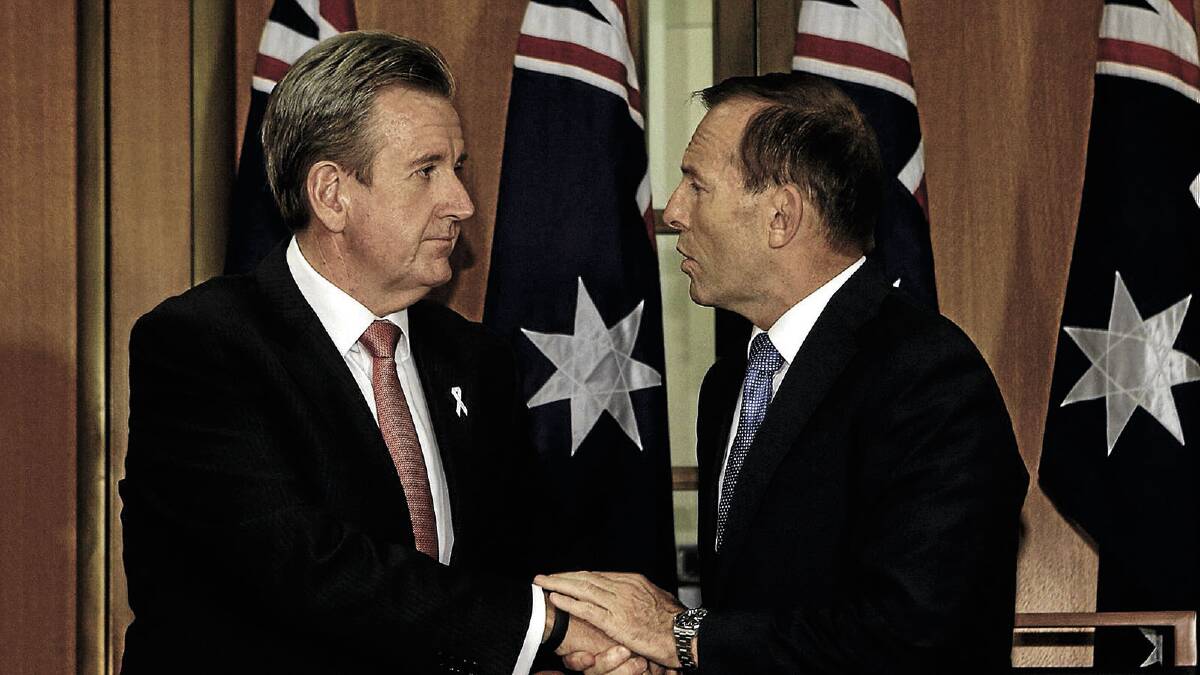 DONE DEAL: Premier Barry O'Farrell and Prime Minister Tony Abbott sign the Murray Darling Basin Plan.