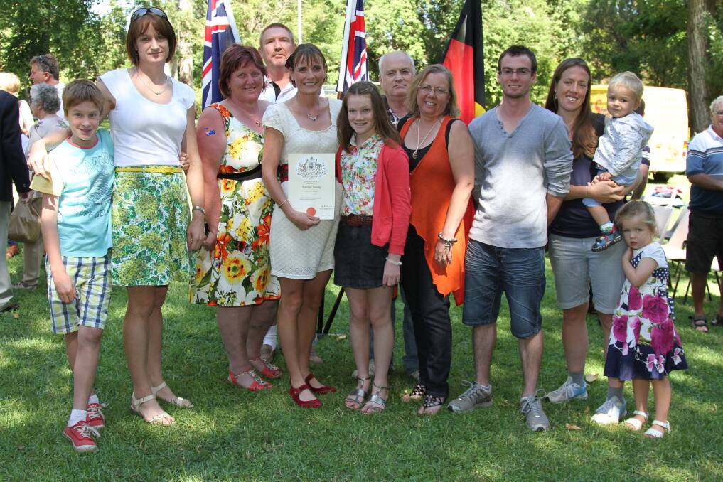 New Australian Citizen Elaine Morgan surrounded by friends who shared her special day as she became one of Australia's newest citizens. Australia Day in Tumut. Picture: Contributed