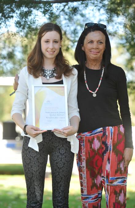 Young Citizen of the year Rachel Warren with Turia Pitt at the Australia Day Celebrations in Narrandera. Picture: Alastair Brook