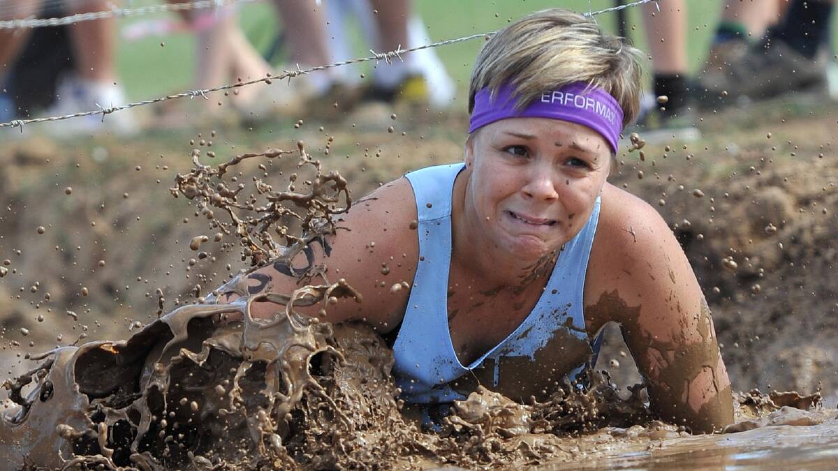 Kellie Murray tackles one of the obstacles during the Mud, Sweat and Beers event near Euberta. Picture: The Daily Advertiser