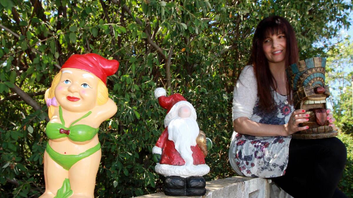 GNOME IS WHERE THE HEART IS: Dona Parise with the mysterious gnomes that have popped up in her garden since Christmas.