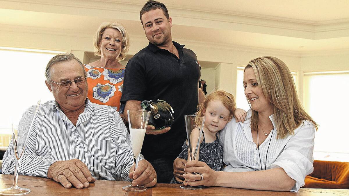 SWEET SUCCESS: Griffith’s new mayor John Dal Broi celebrates his victory with his wife Lurline, son Kirsten, daughter-in-law Kim and granddaughter Cloe, 3. Picture: Anthony Stipo