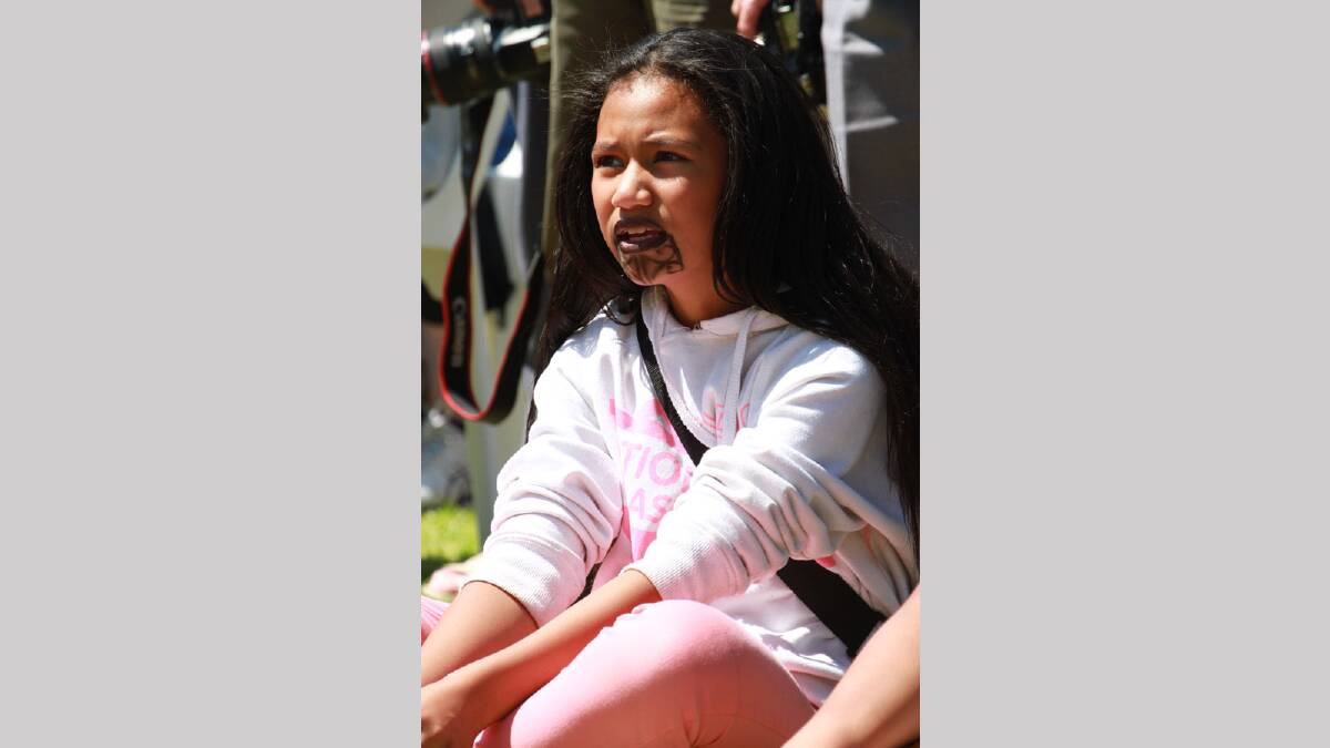 Leni Tuiaki, 12, watches on at the Griffith Multicultural Festival. Picture: Anthony Stipo 