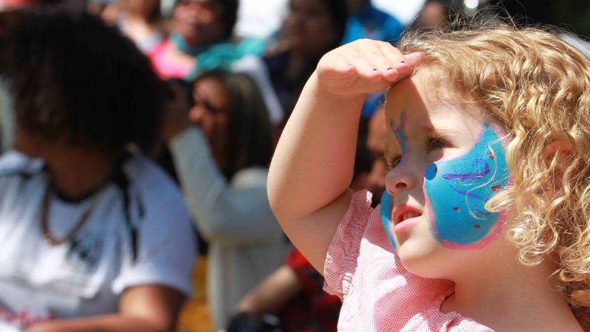 Cailan Lewis, 4, takes a keen interest in the activities at the Griffith Multicultural Festival. Picture: Anthony Stipo
