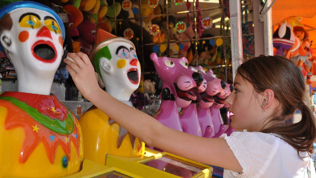 Brittney Taylor, 12, playing on the clowns at the Griffith Show.