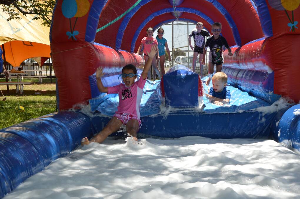 Emma Bagiante, 9, tests out the water slide at the Binya Arts ‘n’ Craft Festival yesterday.