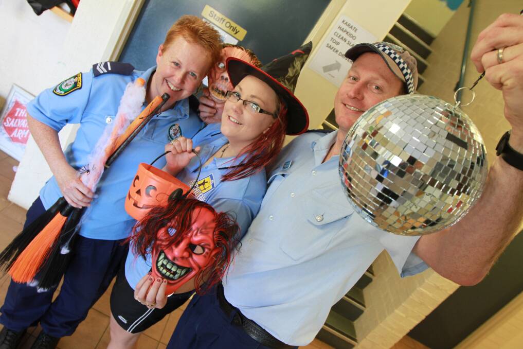CREEPY COMEBACK: Senior Constable Pete Naisby, Griffith  PCYC activity officer Amber Bland and Senior Constable Alex Davies get ready for the return of Griffith's Halloween themed Blue Light Disco tonight. 	Picture: Anthony Stipo