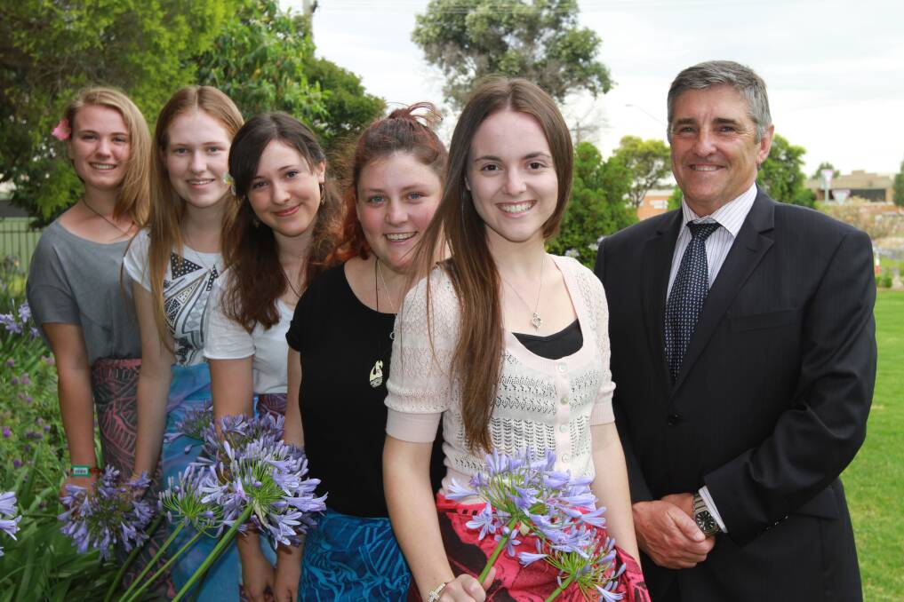 Marian Catholic College year 12 students Kaitlan Rizzeri, Georgia Gair, Natalie Sartor, Kate Sexton and Lauren Jenkins, who helped students in Samoa, pictured with principal Alan Le Brocque.