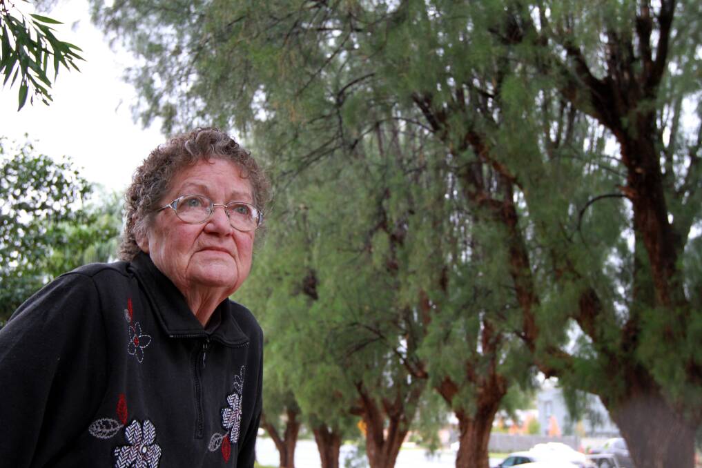 PINE NO MORE: Kookora Street residents, like Rosemary Rogan, will no longer be plagued by needles when the 18 athel pine trees are removed next year.